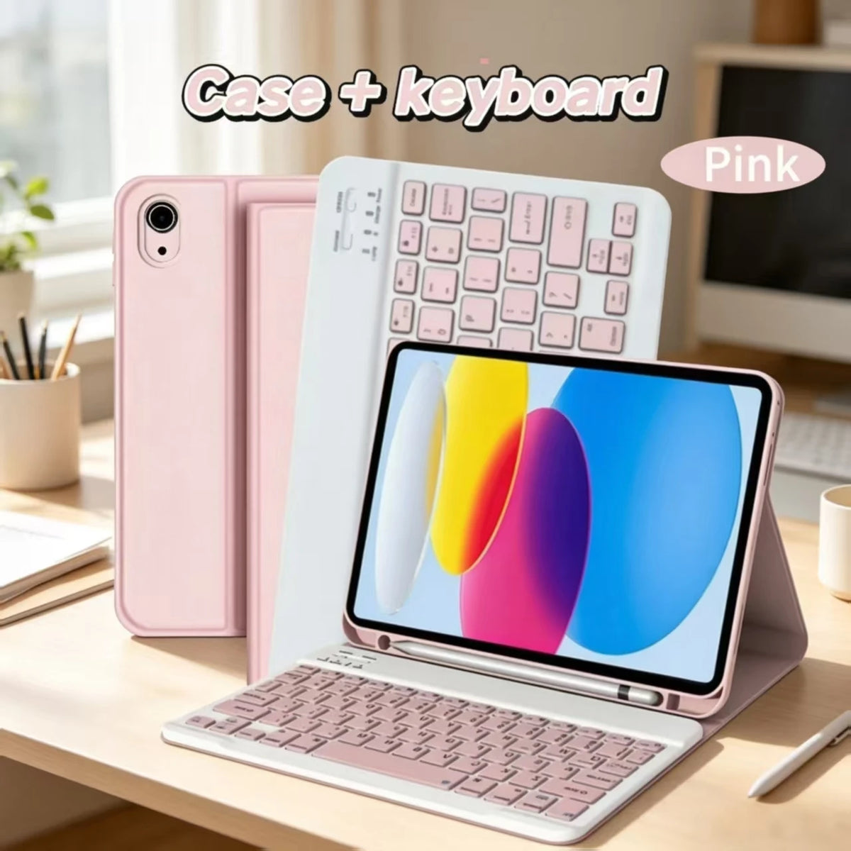 Pink case and keyboard set for an iPad shown on a wooden table.