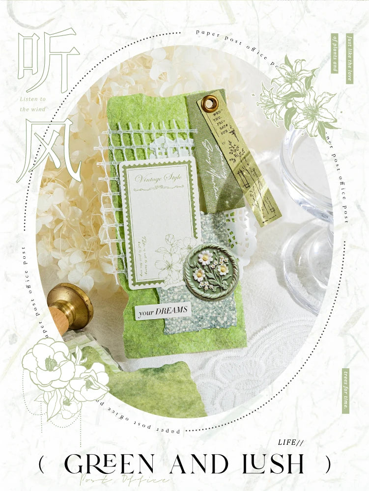 A flat lay of a green and lush paper craft kit featuring vintage style paper, floral elements, and decorative paper goods.