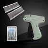 A professional apparel tagging gun kit showing a gun and several tagging needles on a dark background.