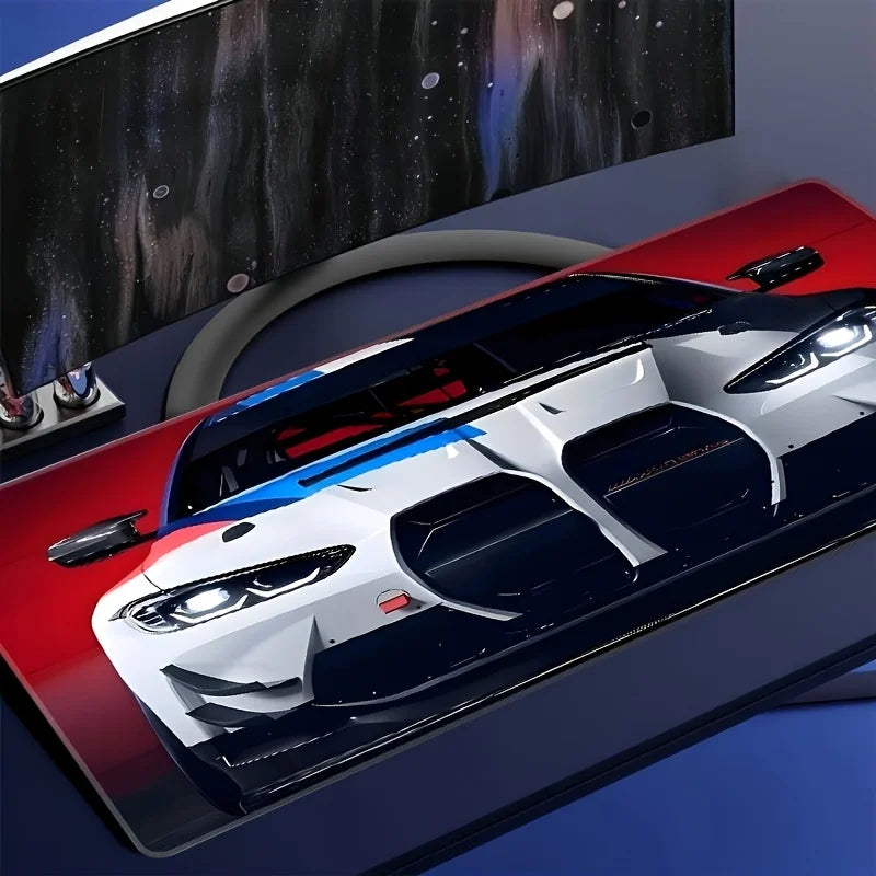 A large non-slip gaming mouse pad featuring a racing car design with red, white, and blue accents.