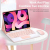 A pink laptop with a keyboard case and mouse is shown on a white table against a pink background.