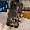 A black phone case featuring detailed gothic floral art with purple and gray flowers.