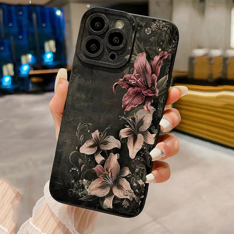 A black phone case featuring detailed gothic floral art with purple and gray flowers.