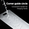 A corner guide circle on a stainless steel cutting board with a convenient handle for hanging hands.