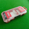 A clear plastic storage case for a Milwaukee impact driver accessory, resting on a green surface.