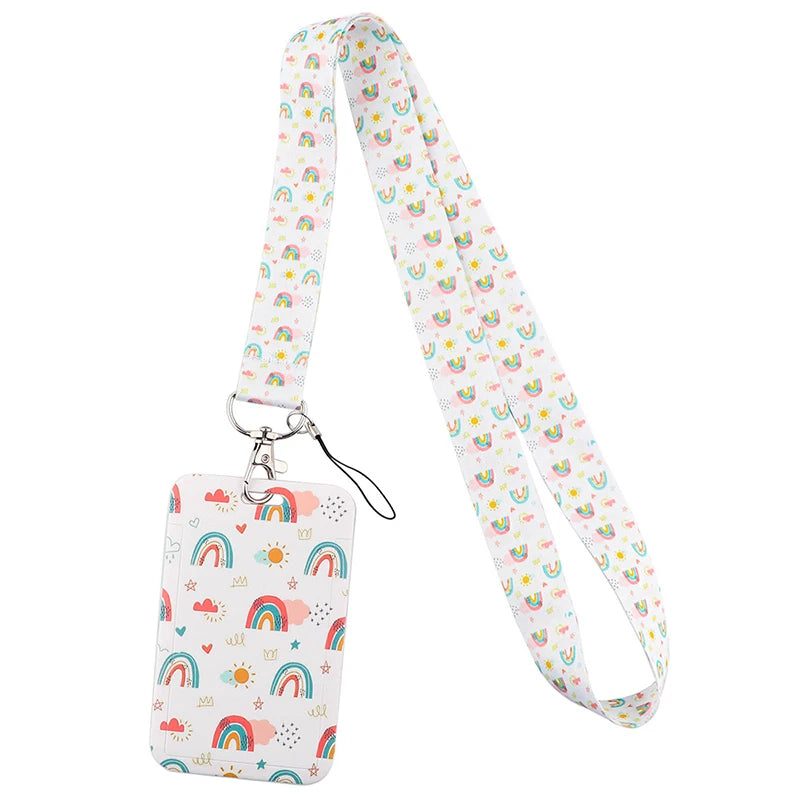 A white and pastel rainbow patterned lanyard with a silver clip and attached ID badge holder.