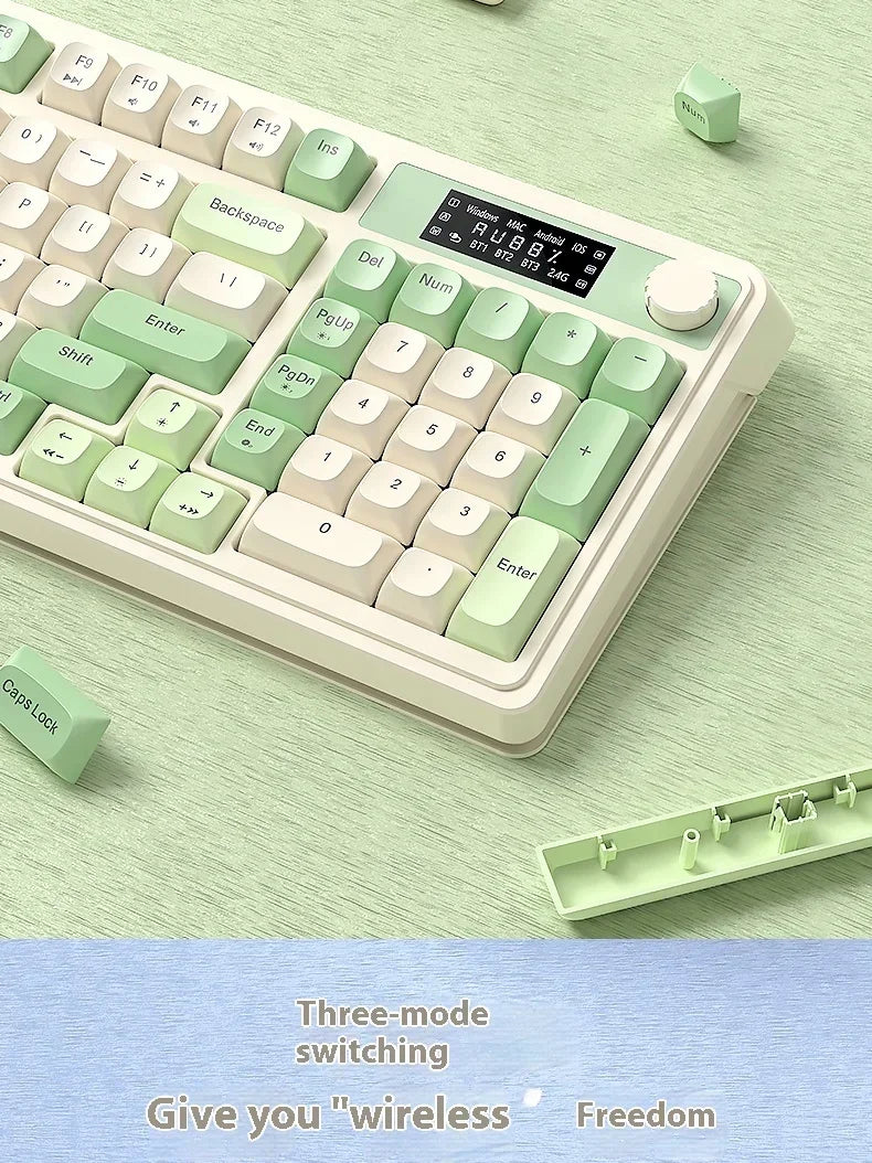 A close-up view of a light green wireless gaming keyboard with customizable keycaps and a separate switch shown nearby.