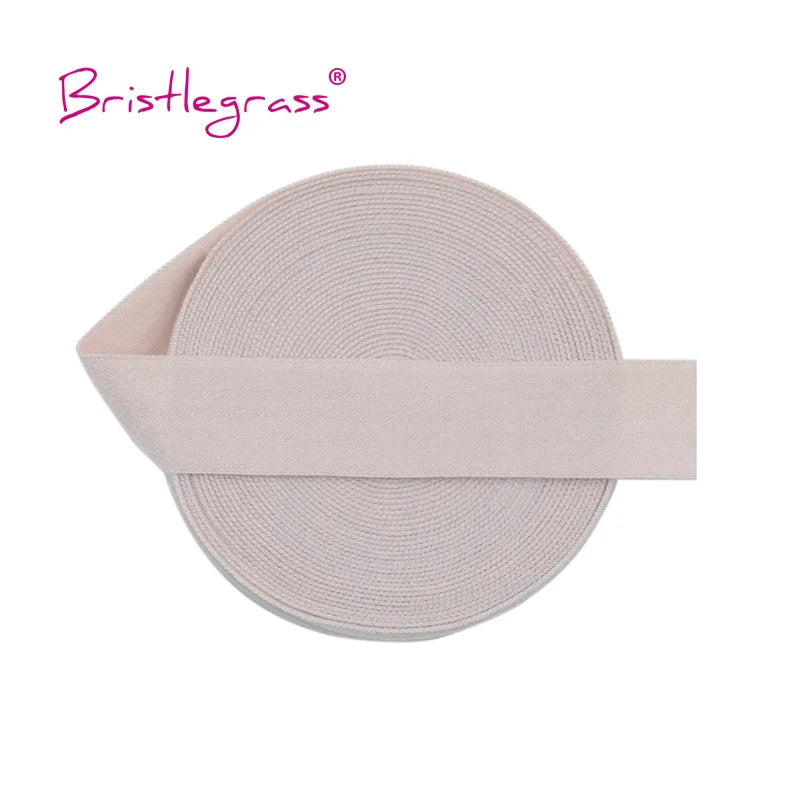 A light pink elastic hair tie or trim with a woven texture shown flat.