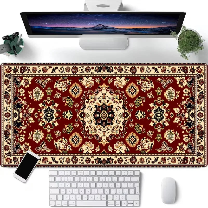 A vintage Persian rug gaming mouse pad with a non-slip rubber base is shown next to a computer monitor and keyboard.