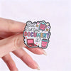 An enamel pin featuring the text But Did You Document It? with colorful icons for office humor