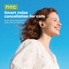 A woman smiling while wearing HTC smart noise cancellation earbuds for calls.