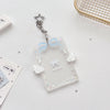 Clear acrylic card holder with a light blue ribbon and silver keychain charm