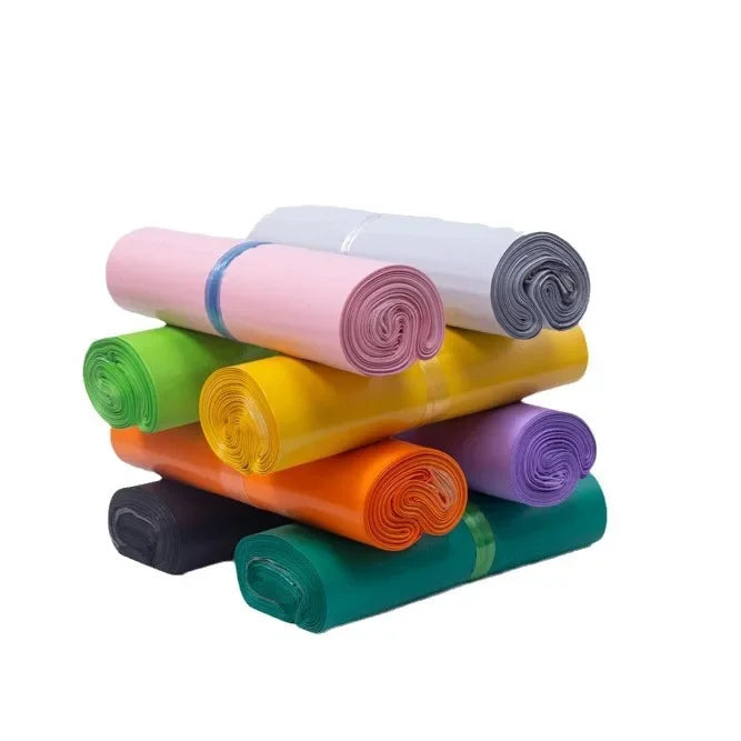 A collection of rolled self-adhesive sealing storage bags in various pastel and bright colors.