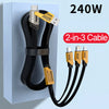A black 2-in-3 multi-USB fast charging cable with yellow connectors plugged into a blue power adapter.
