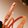 An orange data cable with a built-in phone mount is shown coiled around a piece of wood.