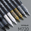 A collection of black acrylic marker pens with gold accents arranged diagonally on a gray surface.