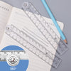 A foldable acrylic geometry ruler set with a 180 degree angle shown next to a pencil on lined paper.