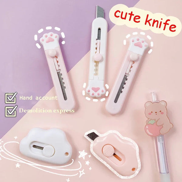 A collection of cute knife tools including a hand account, demolition express, and various mini cutters for mail and crafts.