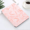 A pink marble-patterned silicone skin for an iPad Pro resting on a white surface.