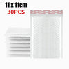 Stack of white self-sealing pearl film bubble shipping bags