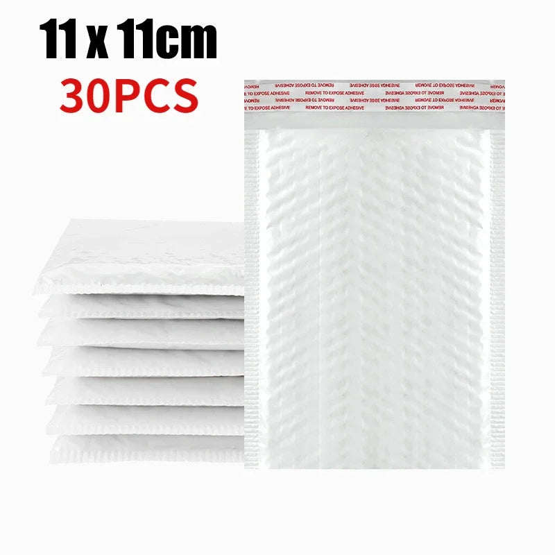 Stack of white self-sealing pearl film bubble shipping bags