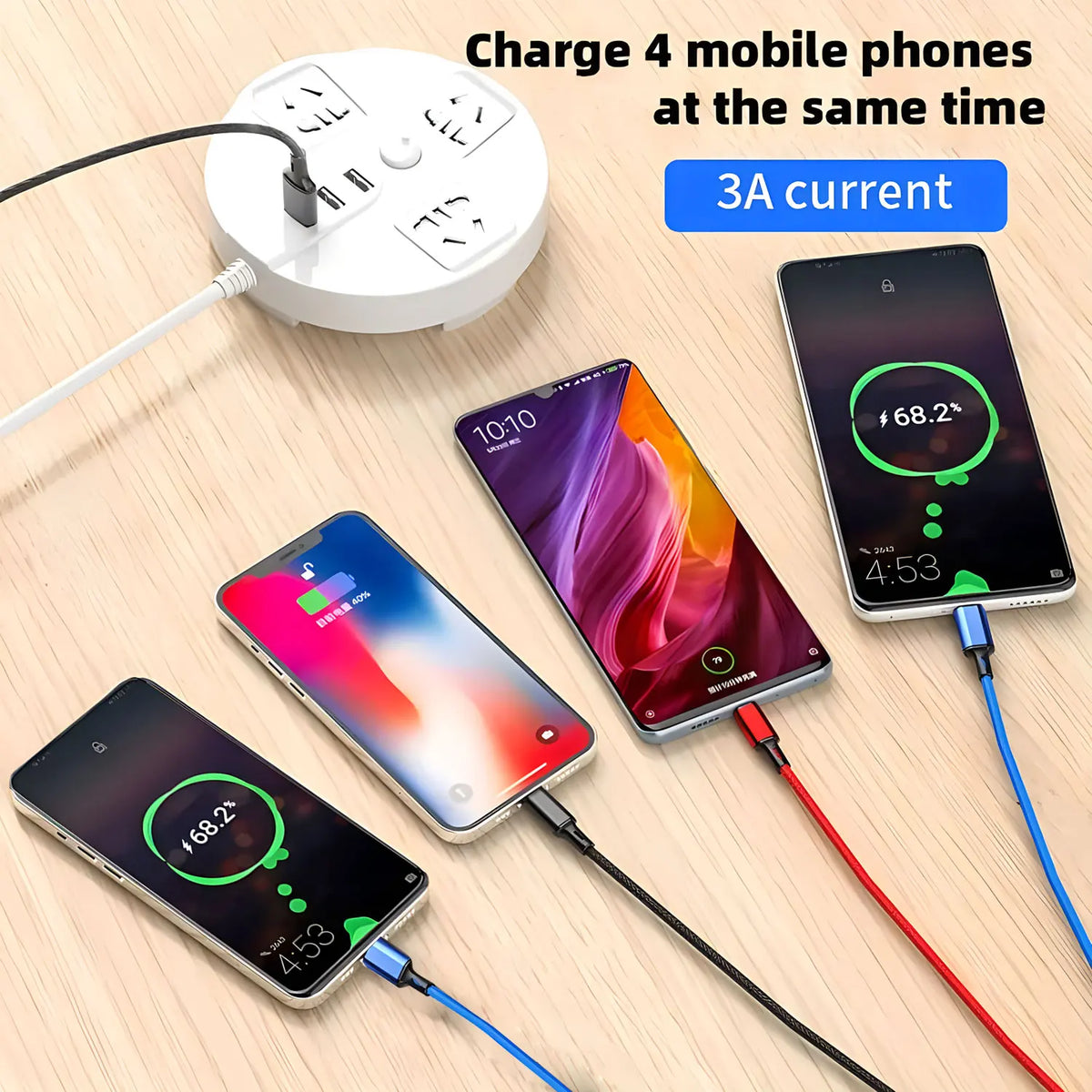 A white charging hub is shown with four cables charging mobile phones simultaneously.