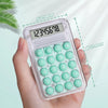 A hand holds a pink mini silent calculator displaying 12345678 on a light green background.