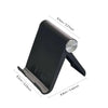 A black foldable desktop phone holder with a silver circular attachment.