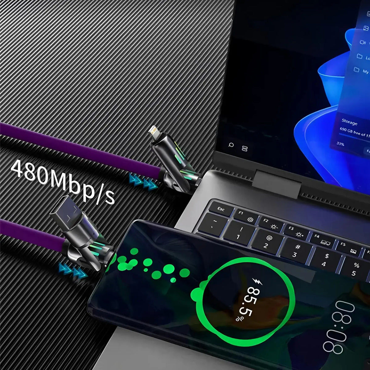 A close-up of a laptop and smartphone showing a purple fast charging cable with rotating connectors.