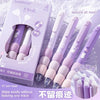 A box of purple and pink gel pens with soft grips is shown alongside several pens, demonstrating their use for leisure at noo