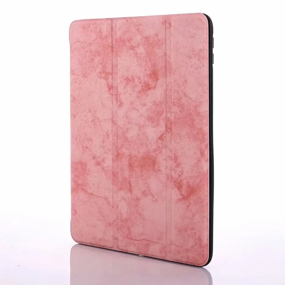 A pink retro marbling skin for an iPad Pro shown in a vertical view.