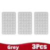 Three grey silicone suction cup phone holders packaged together