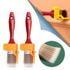 A pair of precision corner paint brushes with red handles and yellow bases, shown next to a brush head detail.