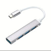 A white 4-port USB 2.0 hub with an OTG adapter and a flexible cable.
