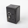 A black compact home safe box with a visible combo lock and keys.