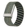 A close-up view of a gray and black braided nylon strap for a fitness watch.