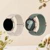 A pair of Quick Release braided loop watch bands for Garmin devices, one in white and one in sage green.