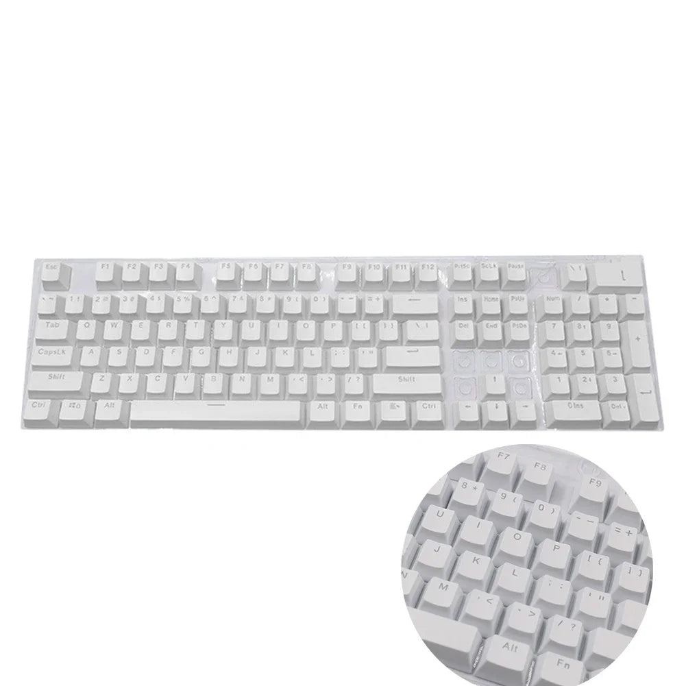 A close-up view of a white 104-key mechanical keyboard keycap set with various letter and function keys.