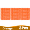 Three orange silicone suction cup phone holders arranged in a row.