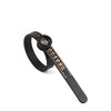 A black ring sizer and measuring tool with a magnifier showing numbered rings.