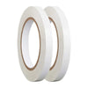 A pair of white double-sided craft adhesive tapes rolled on a dispenser.