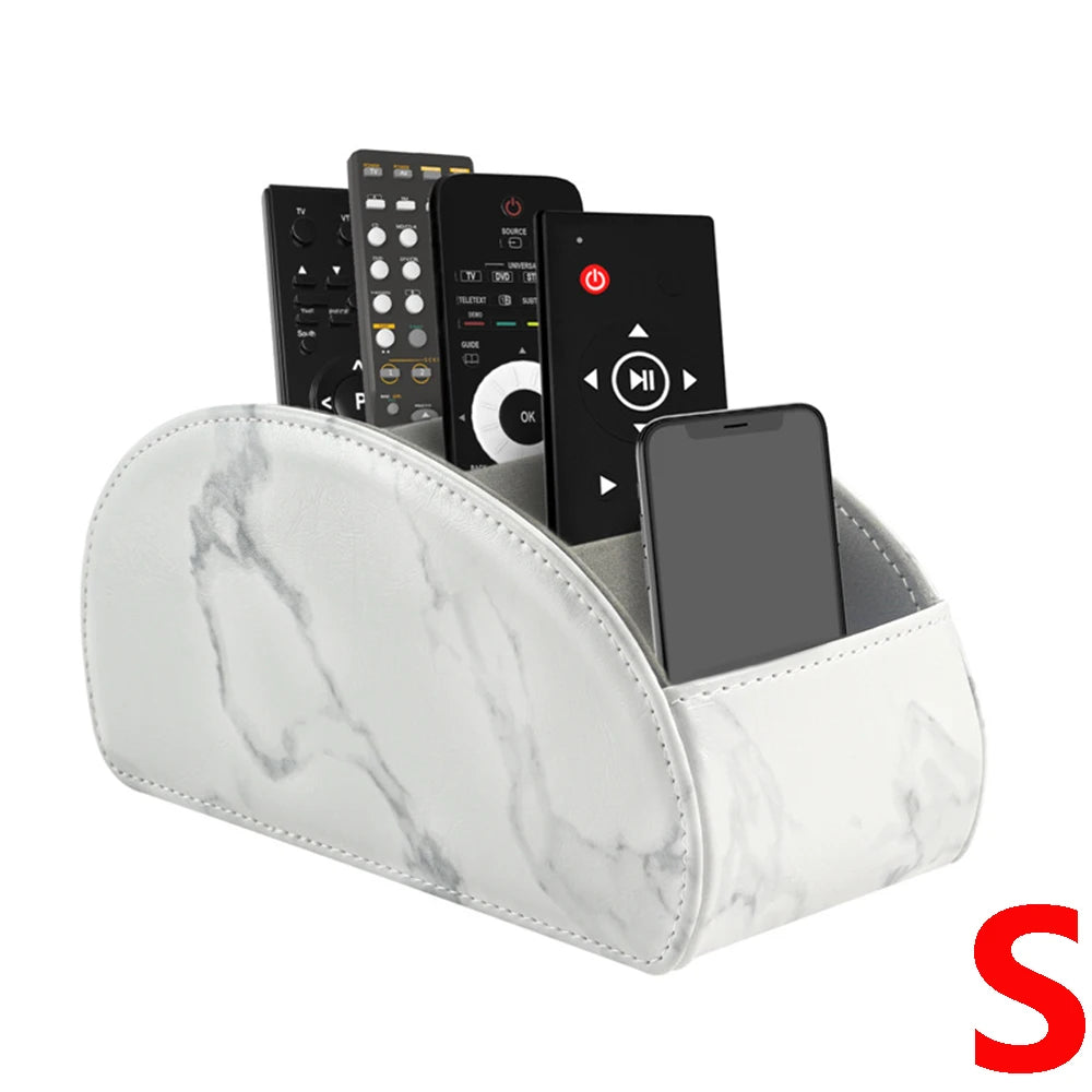 A white marble PU leather remote control holder with five compartments displaying various electronic devices.