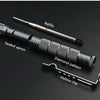 A tactical self-defense pen with a diamond pattern tip and hollow clip is shown on a dark surface.