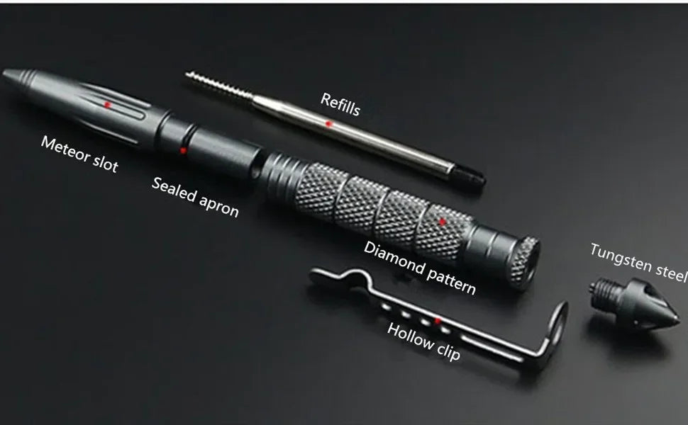 A tactical self-defense pen with a diamond pattern tip and hollow clip is shown on a dark surface.
