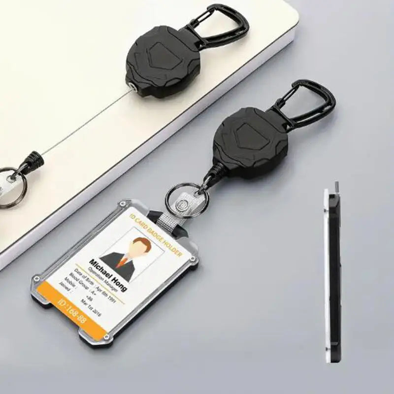 A black tactical ID badge holder keychain with an attached ID card and a carabiner clip.