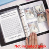 A hand is holding a black folder containing a 100 envelope saving challenge tracker with stacks of US hundred dollar bills.
