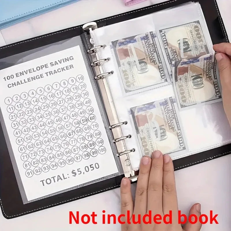 A hand is holding a black folder containing a 100 envelope saving challenge tracker with stacks of US hundred dollar bills.