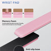 Pink ergonomic keyboard wrist pad with a black anti-slip base shown in detail.