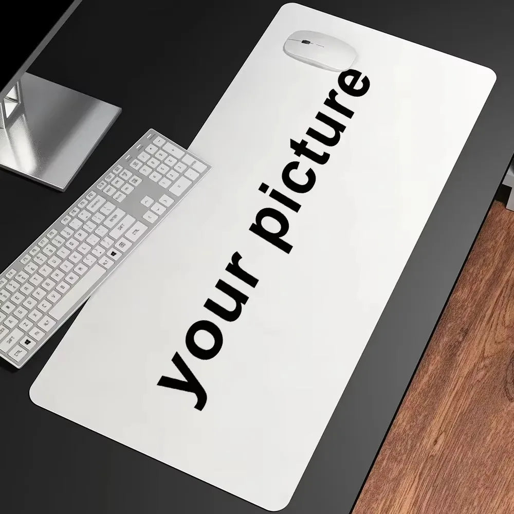 A white extended gaming desk mat featuring the text Your picture and a mouse resting on it.