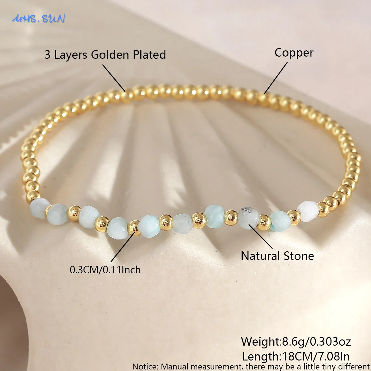 A gold-plated beaded bracelet featuring natural light blue shell pearls and copper plating.